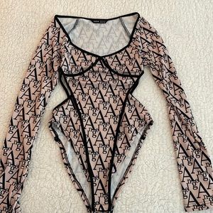 Nude graphic print bodysuit with side cut-outs.